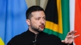 Ukraine's President Volodymyr Zelensky gestures as he speaks at a joint press conference with unseen South Africa's President Cyril Ramaphosa during an official visit by Zelensky to South Africa, at the Union Buildings in Pretoria on April 24, 2024. (Phot