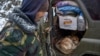 NAGORNO-KARABAKH -- A man shows a newborn calf in his car on a road outside the town of Lachin, November 29, 2020
