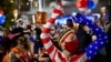 Supporters of former Vice President Joe Biden celebrate in Philadelphia, Pennsylvania on November 7, 2020 after the prognosis that Biden has received sufficient Electoral College votes to become president of the United States. 